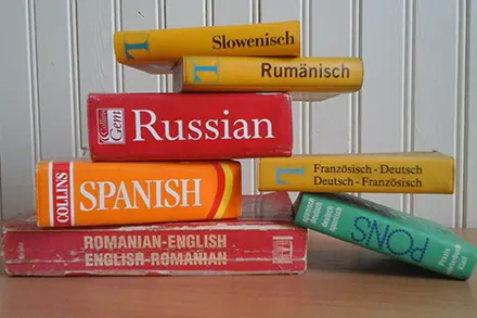 Pile of books with different language titles