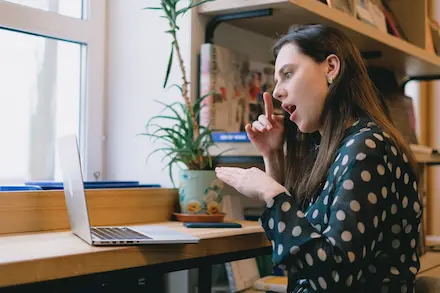 Woman on her laptop at a desk